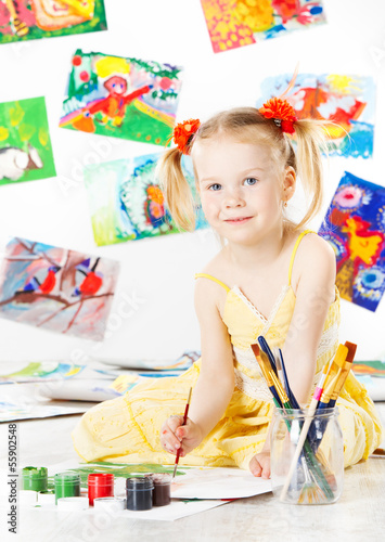 Photo: child drawing, girl painting with brush, Creativity concept. child drawing, girl painting with brush, Creativity concept.