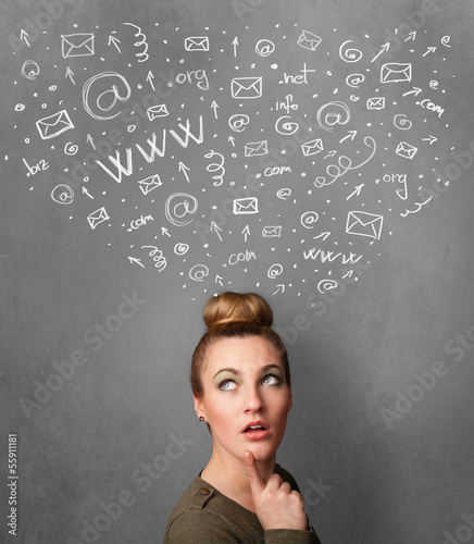 Photo: Young woman thinking with social network icons above her head Young woman thinking with social network icons above her head
