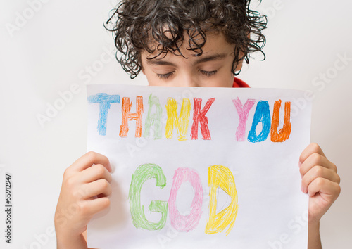 Photo: Hispanic child holding a religious sign Hispanic child holding a religious sign
