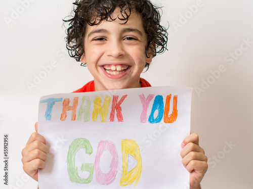 Photo: Hispanic child holding a religious sign Hispanic child holding a religious sign