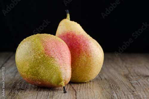 Photo: Pears in a old wooden table Pears in a old wooden table