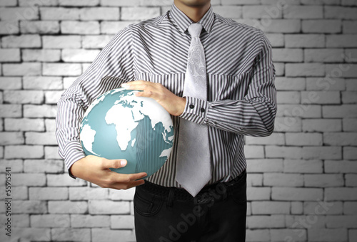 Photo: earth globe in his hands earth globe in his hands