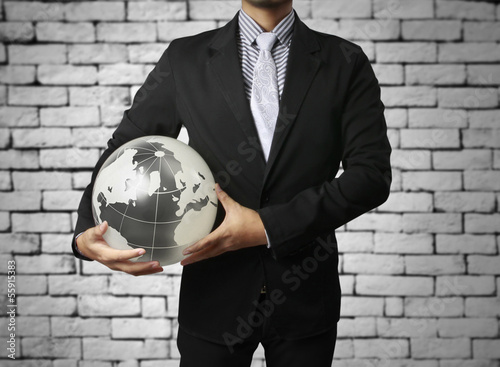 Photo: earth globe in his hands earth globe in his hands