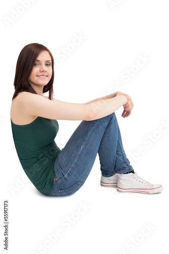 Photo: Cheerful attractive brunette sitting Cheerful attractive brunette sitting