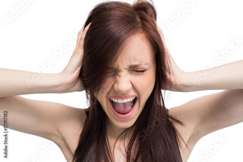 Photo: Close up on exasperated brunette screaming Close up on exasperated brunette screaming