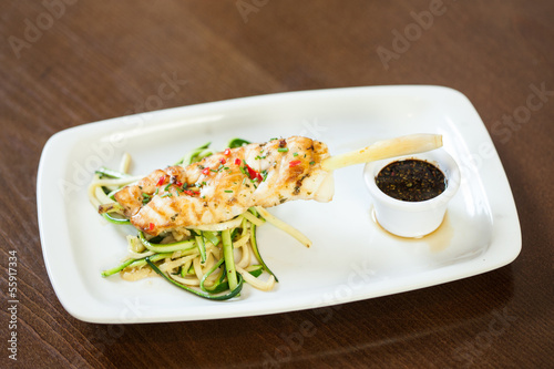 Photo: Asian inspired fish dish with noodles and julienne vegetables Asian inspired fish dish with noodles and julienne vegetables
