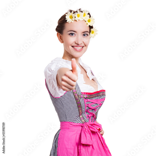 Photo: junge Frau im Dirndl zeigt Top-Daumen junge Frau im Dirndl zeigt Top-Daumen