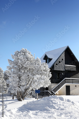 Photo: Picturesque snow covered house Picturesque snow covered house
