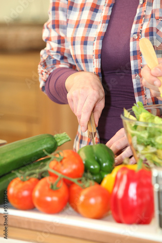 Photo: Woman chopping vegetables Woman chopping vegetables