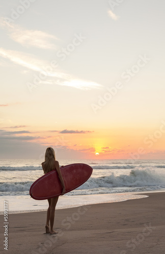 Photo: Woman Surfer Girl In Bikini Surfboard Sunset Beach Woman Surfer Girl In Bikini Surfboard Sunset Beach