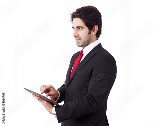 Photo: Handsome smiling businessman with tablet computer. Isolated over Handsome smiling businessman with tablet computer. Isolated over