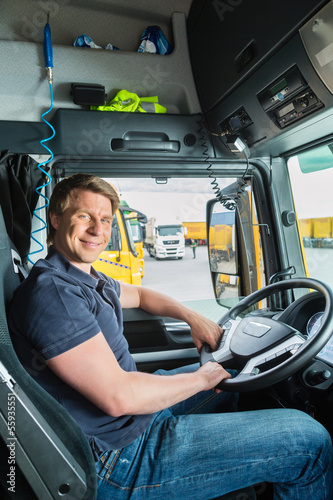 Photo: Forwarder or truck driver in drivers cap Forwarder or truck driver in drivers cap