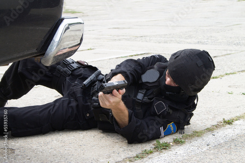 Photo: policeman lying on the ground policeman lying on the ground