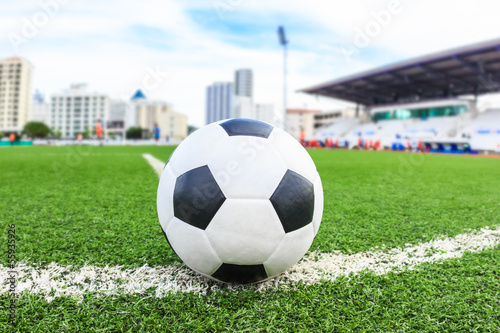 Photo: soccer ball on green grass field soccer ball on green grass field