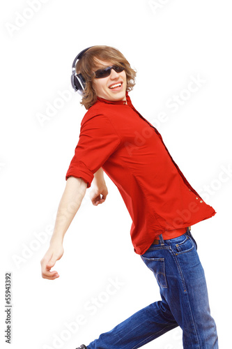 Photo: Happy smiling young man dancing Happy smiling young man dancing