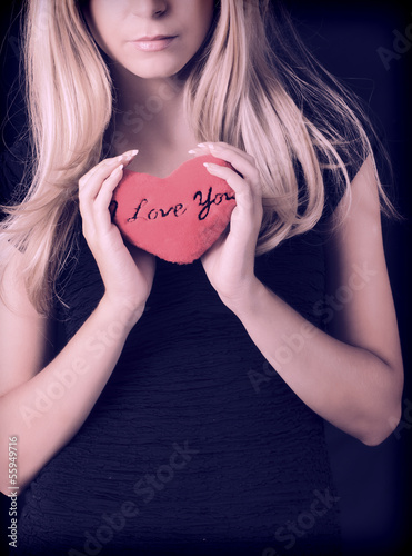 Photo: Holding plush heart Holding plush heart
