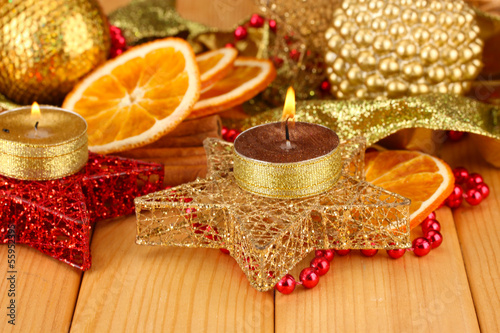 Photo: Christmas composition with candles and decorations Christmas composition with candles and decorations