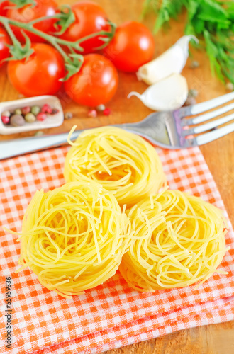 Photo: raw pasta and tomato raw pasta and tomato