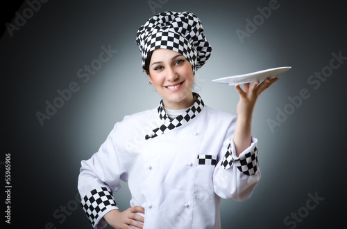Photo: Pretty cook with kitchen utensils Pretty cook with kitchen utensils