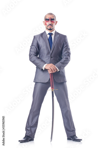 Photo: Businessman with sword isolated on white Businessman with sword isolated on white