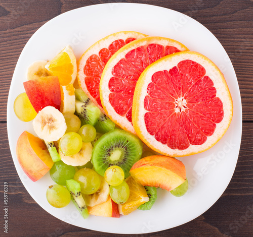 Photo: Assortment of sliced fruits on plate Assortment of sliced fruits on plate