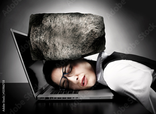 Photo: Woman with laptop having stress. Woman with laptop having stress.
