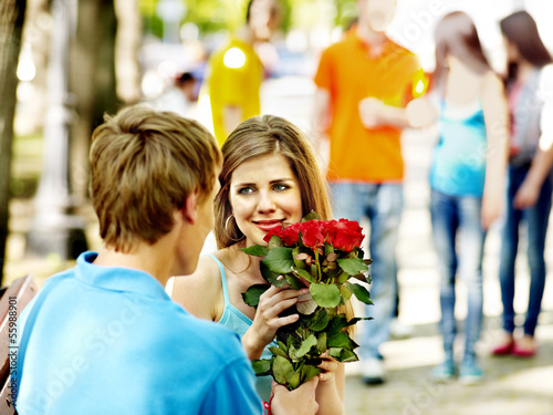 Photo: Couple of people on date outdoor. Couple of people on date outdoor.