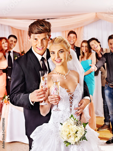 Photo: Wedding couple drinking champagne Wedding couple drinking champagne