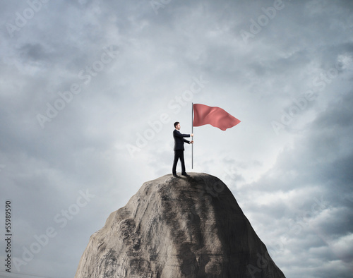 Photo: businessman with red flag businessman with red flag