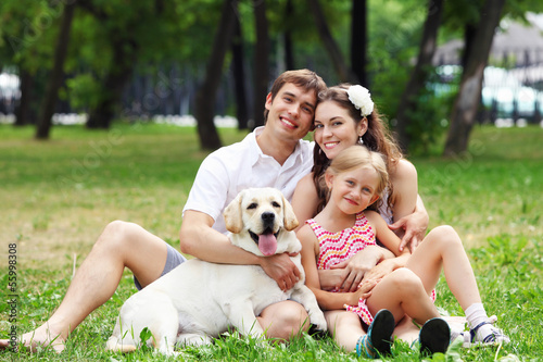 Photo: Happy family having fun outdoors Happy family having fun outdoors