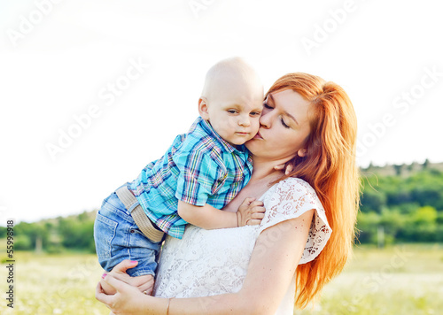 Photo: mother kissing baby son mother kissing baby son