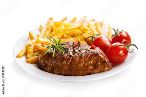 Photo: plate of grilled meat with french fries plate of grilled meat with french fries