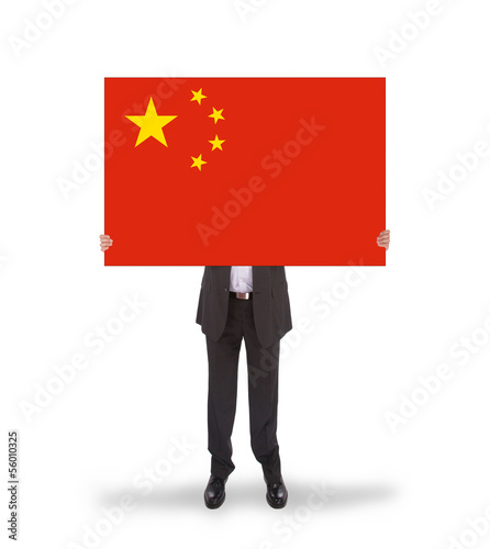 Photo: Businessman holding a big card, flag of China Businessman holding a big card, flag of China