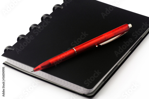 Photo: buch mit schreibstift buch mit schreibstift