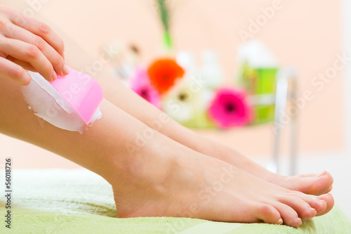 Photo: Woman in Spa getting a hair removal Woman in Spa getting a hair removal