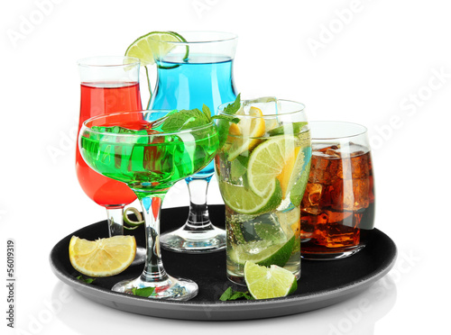 Photo: Many glasses of cocktails on tray, isolated on white Many glasses of cocktails on tray, isolated on white