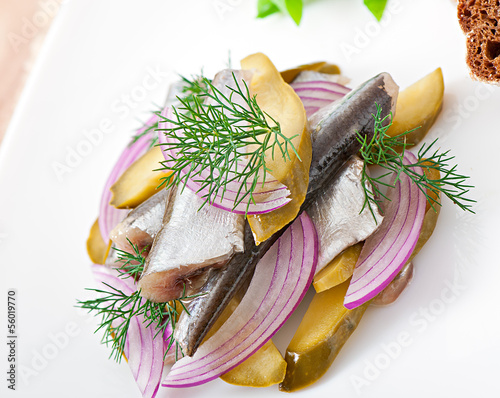 Photo: herring salad with pickled cucumbers and onions herring salad with pickled cucumbers and onions