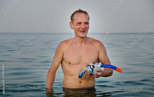 Photo: Laughing man with goggles and snorkel Laughing man with goggles and snorkel