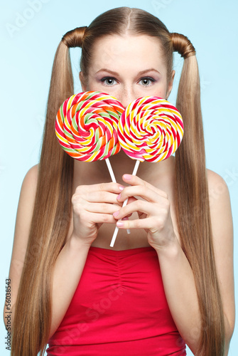 Photo: Young woman with lollipop Young woman with lollipop