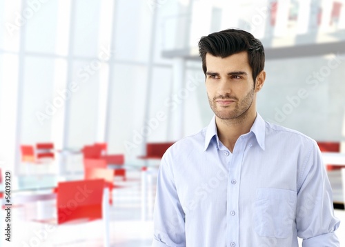 Photo: Young man in business hall Young man in business hall