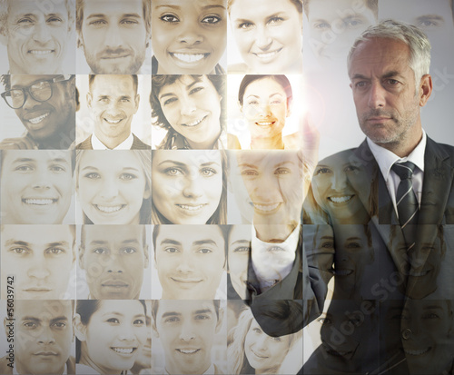 Photo: Serious businessman choosing future employees Serious businessman choosing future employees