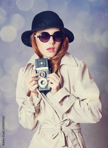 Photo: Redhead girl in cloak with camera as a spy Redhead girl in cloak with camera as a spy