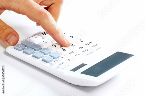 Photo: Hand with calculator. Hand with calculator.