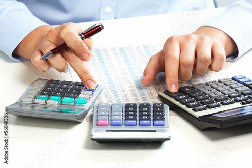 Photo: Hand with calculator. Hand with calculator.