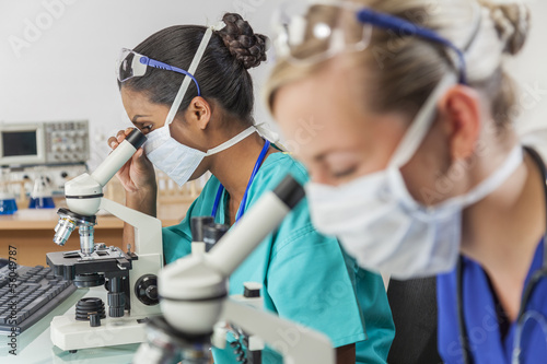 Photo: Asian Female Scientist Using Microscope in Laboratory Asian Female Scientist Using Microscope in Laboratory