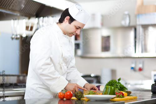 Photo: Chef cooking in his kitchen Chef cooking in his kitchen
