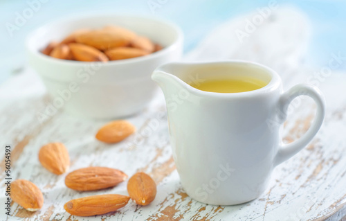 Photo: almond essential oil and almond in bowl almond essential oil and almond in bowl