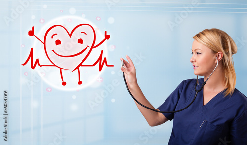 Photo: Attractive doctor with happy red smiling heart Attractive doctor with happy red smiling heart