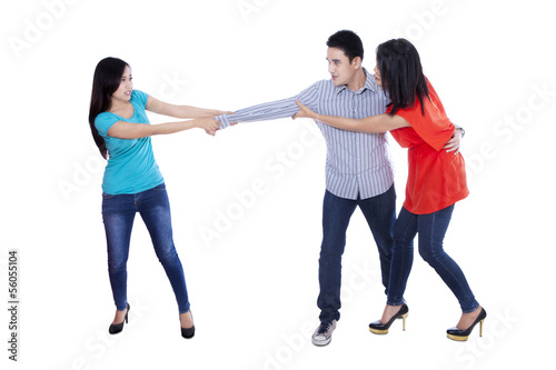 Photo: Two beautiful woman fighting over man Two beautiful woman fighting over man