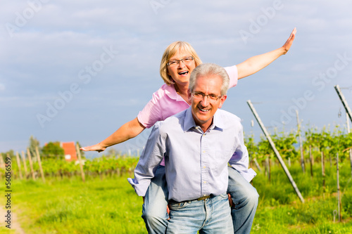Photo: Senior man and woman walking hand in hand Senior man and woman walking hand in hand